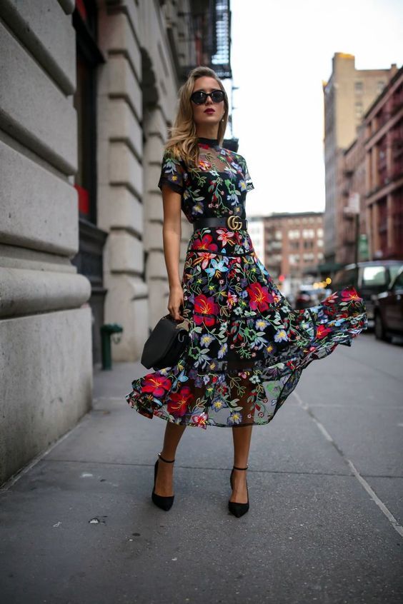 11-a-moody-floral-midi-dress-with-a-sheer-bodice-and-skirt-short-sleeves-and-black-shoes-and-a-bag (1)